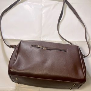 Brown woman’s vegan leather hand bag.